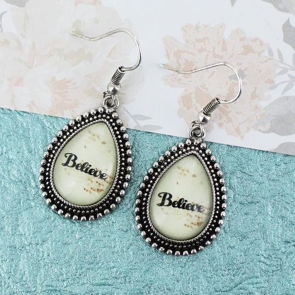 Jewelry - NWT Silvertone Framed "Believe" Bubble Earrings